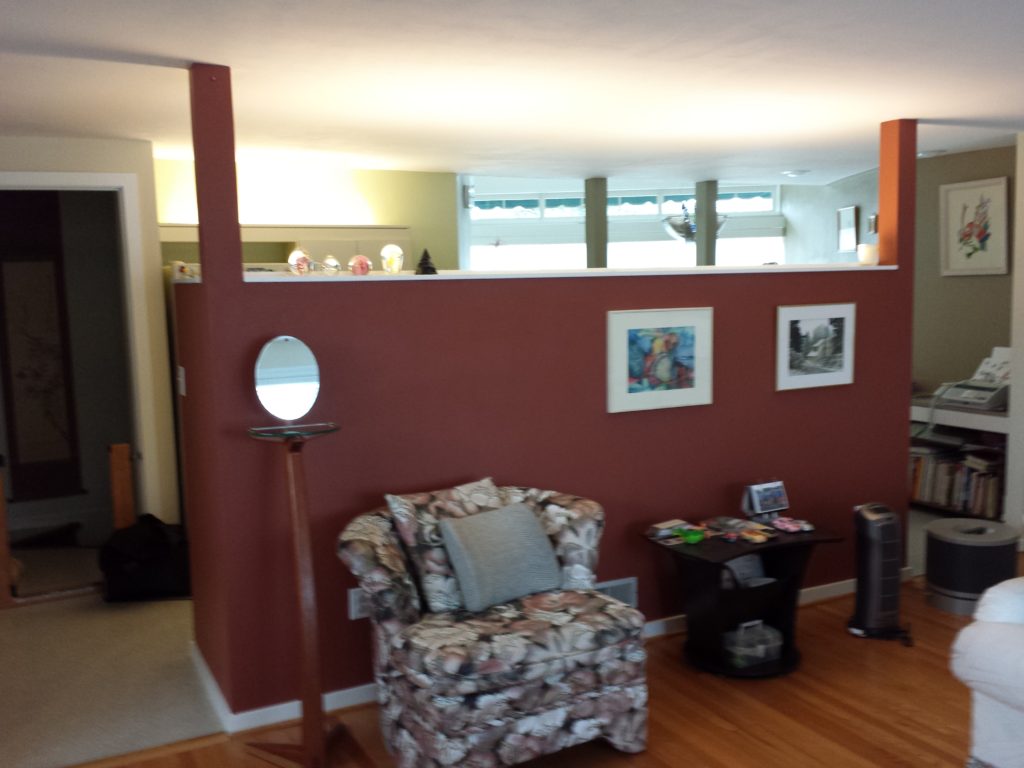 The before kitchen with high wall separating the kitchen from living room