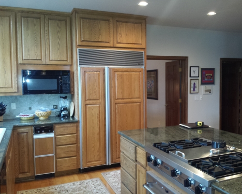 The before view of the refrigerator with cabinet fronts.