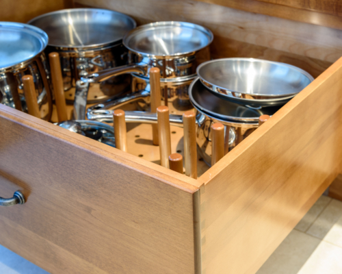 Organized, peg deep drawer storage for pots and pans