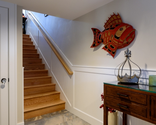 Stairs from the basement looking up to the main floor.