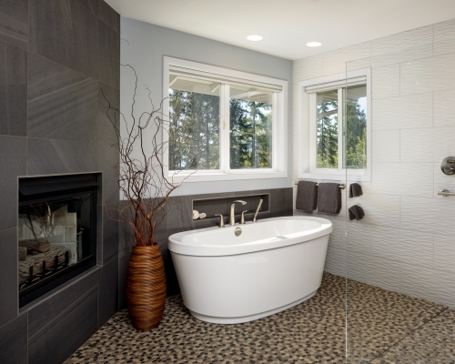 The newly remodeled fireplace and tub