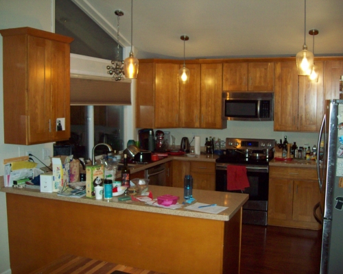 The cramped and cluttered kitchen.