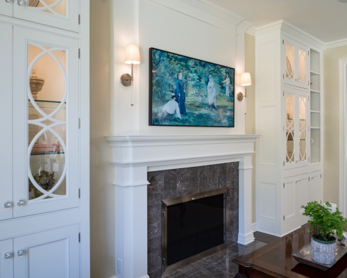 New living room features glass-front cabinets