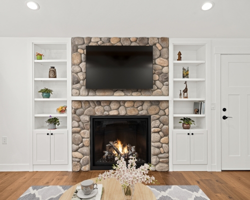 The new fireplace with built-in bookshelves