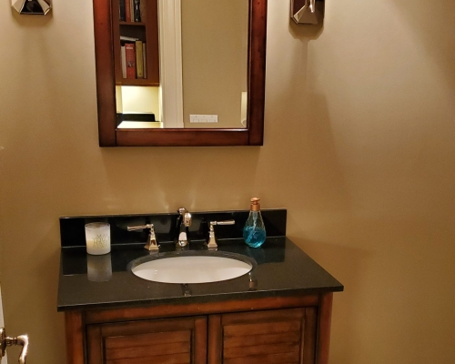 The original bathroom with small sink.