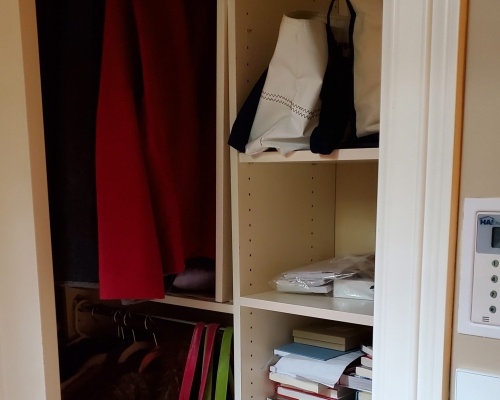 The coat closet before.