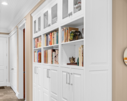 Beautiful built-in bookshelves in the hall to contain clutter.