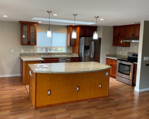 Previously, the island had a curved countertop that cut into the living room.