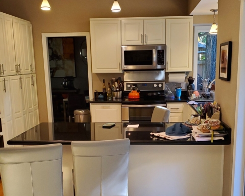 The kitchen before was small and closed off from the rest of the house.